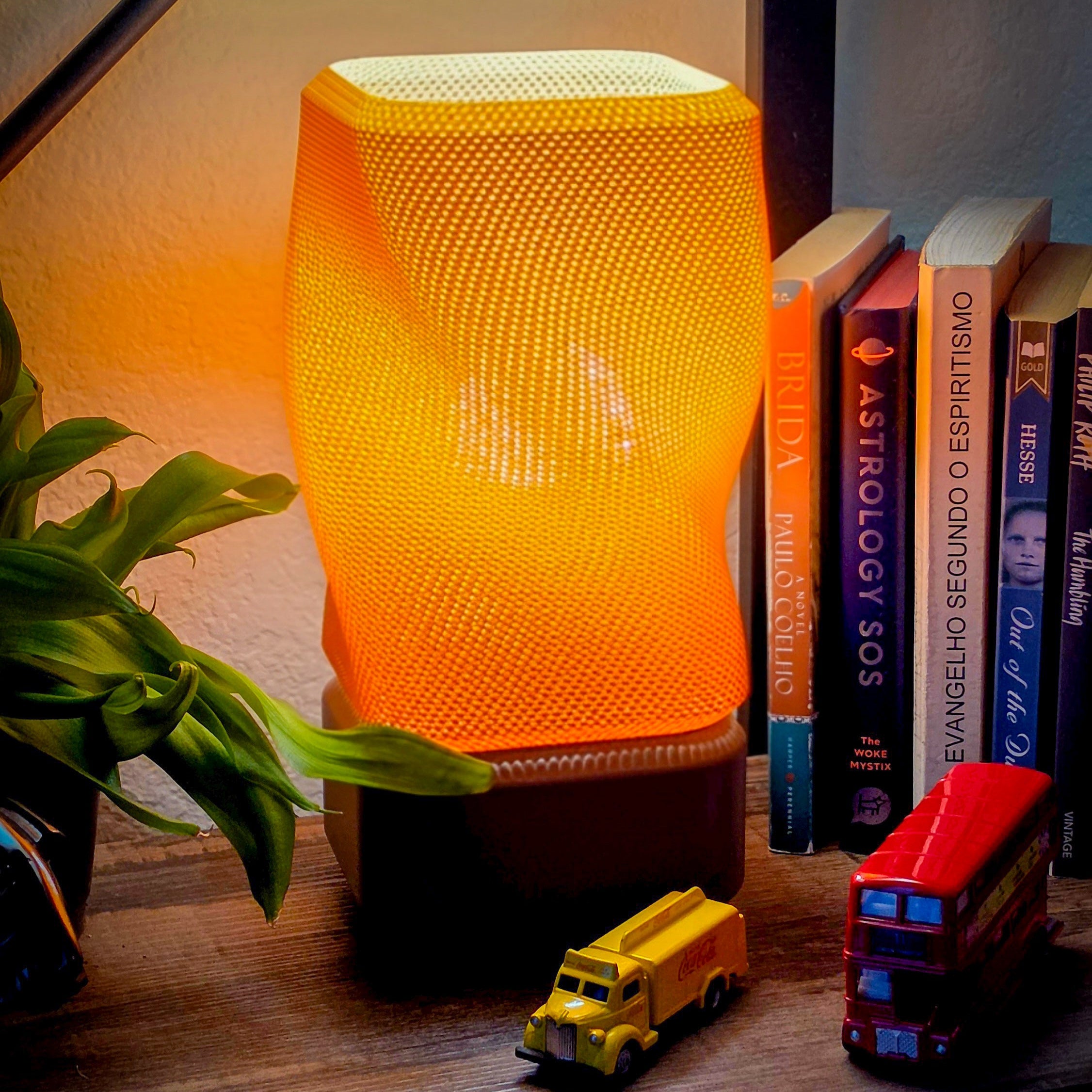 Close-up of the 3D printed orange mesh lamp texture